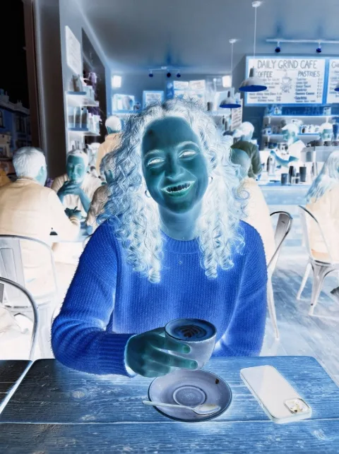 The same photo with inverted colours, like a negative